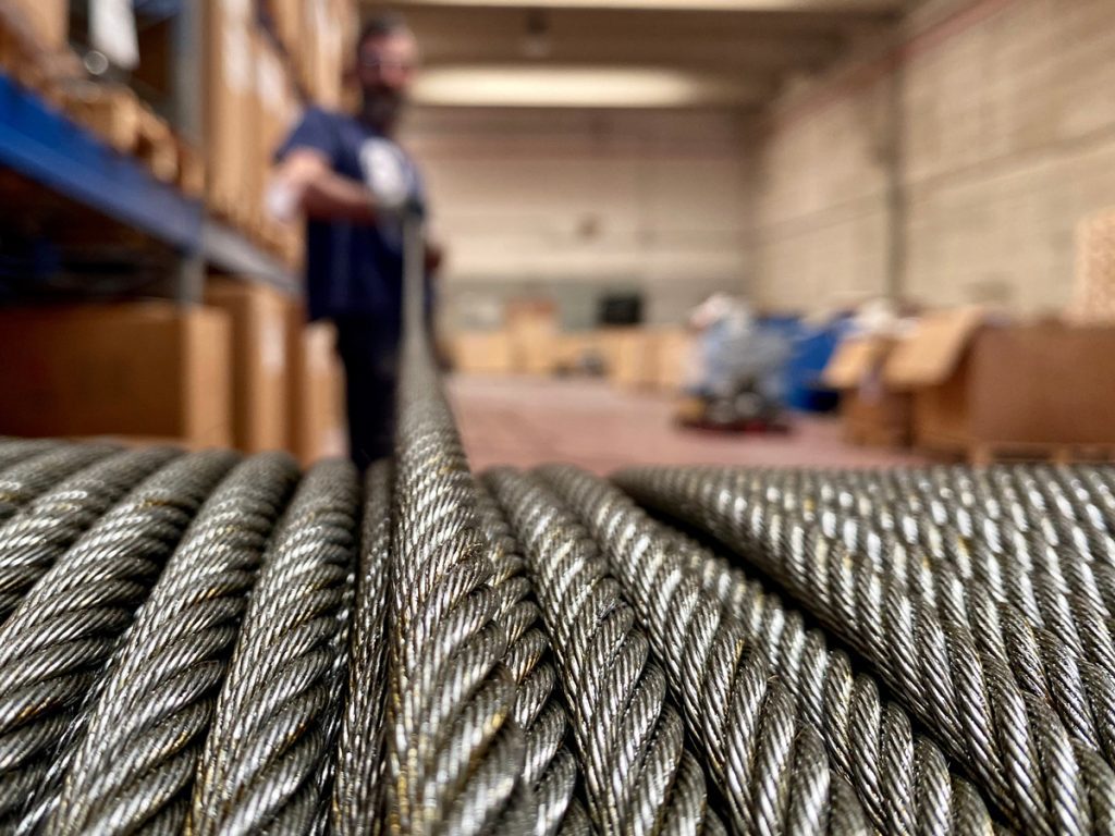 Using Free ERP Software? Here’s Why It’s Slowing Your Growth 2 The Rubicon Group Man-pulling-spool-of-heavy-stell-cables